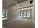Bright bedroom featuring large windows, beautiful trim work, and a coffered ceiling at 194 Landon Ridge, Sanford, NC 27330