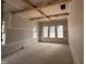 Bedroom featuring three windows, exposed wood beams and drywall at 194 Landon Ridge, Sanford, NC 27330