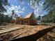 New home construction shows sheathed framing under a blue sky, highlighting the structure and neighborhood at 194 Landon Ridge, Sanford, NC 27330