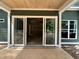 Spacious covered patio with sliding glass doors, ideal for outdoor entertaining and relaxing at 194 Landon Ridge, Sanford, NC 27330