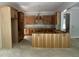 Bright, unfinished kitchen showcasing wooden cabinets and a spacious island layout at 194 Landon Ridge, Sanford, NC 27330