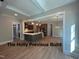 Open-concept kitchen and living area, featuring a large center island and stainless steel appliances at 194 Landon Ridge, Sanford, NC 27330