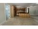 Open kitchen with wooden cabinets, island and abundant natural light from windows at 194 Landon Ridge, Sanford, NC 27330