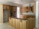 Spacious kitchen with wooden cabinets and a large center island awaiting countertops at 194 Landon Ridge, Sanford, NC 27330