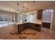Open-concept kitchen with an island, modern appliances, and adjacent dining area at 194 Landon Ridge, Sanford, NC 27330