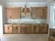 View of unfinished kitchen cabinets, ready for countertop installation and final touches at 194 Landon Ridge, Sanford, NC 27330