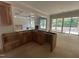 Unfinished kitchen with wooden cabinets, island, and seamless connection to the living area at 194 Landon Ridge, Sanford, NC 27330