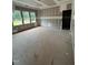 Unfinished living room with backyard view through large windows at 194 Landon Ridge, Sanford, NC 27330