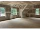 Bright unfinished room with angled ceiling and multiple windows at 194 Landon Ridge, Sanford, NC 27330