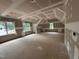 Large unfinished living room features angled ceilings and many windows at 194 Landon Ridge, Sanford, NC 27330
