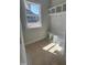 Functional mudroom with a window, shelving, coat hooks and a bench for convenience at 194 Landon Ridge, Sanford, NC 27330