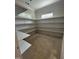 Walk-in pantry featuring expansive shelving for optimal organization and storage at 194 Landon Ridge, Sanford, NC 27330