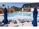 Resort style pool with lounge chairs, umbrellas and covered seating area at 2000 Clydner Dr, Apex, NC 27523