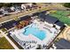 Aerial view of the community pool, parking area, and tennis courts at 2000 Clydner Dr, Apex, NC 27523