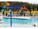 Large community pool with a splash pad for of all ages at 2000 Clydner Dr, Apex, NC 27523