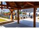 Poolside pavilion with multiple grills, a bar, and tables for residents at 2000 Clydner Dr, Apex, NC 27523