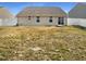 View of the fenced backyard with patio and vinyl siding, a peaceful spot for outdoor enjoyment at 2079 Alderman Way, Creedmoor, NC 27522