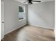 Bright bedroom with new floors, neutral paint, ceiling fan, and natural light from a window at 2079 Alderman Way, Creedmoor, NC 27522