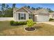 Charming home featuring a well-manicured lawn and an attached garage at 2079 Alderman Way, Creedmoor, NC 27522