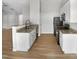 Clean kitchen with white cabinets, granite countertops, and modern black appliances at 2079 Alderman Way, Creedmoor, NC 27522
