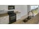 Functional kitchen featuring granite countertops and gas range at 2079 Alderman Way, Creedmoor, NC 27522