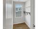 Laundry room featuring a large window, shelving, and modern floors at 2079 Alderman Way, Creedmoor, NC 27522