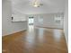 Spacious living room featuring new floors, neutral paint, ceiling fan, and natural light from windows at 2079 Alderman Way, Creedmoor, NC 27522