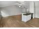 Open-concept living room and kitchen area featuring granite countertops and stainless steel appliances at 2079 Alderman Way, Creedmoor, NC 27522