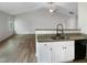Open-concept living room and kitchen area featuring modern countertops and stainless steel appliances at 2079 Alderman Way, Creedmoor, NC 27522