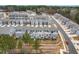 Birds-eye view of the backs of townhomes, featuring balconies, patios and well-kept landscaping at 2140 Stegemann St, Apex, NC 27502