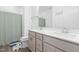 Bright bathroom with double sink vanity and tub/shower combo at 2140 Stegemann St, Apex, NC 27502