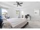 Relaxing bedroom boasts tray ceiling, large windows, and reading nook near a workspace at 2140 Stegemann St, Apex, NC 27502