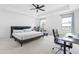 Bright bedroom with tray ceiling, ceiling fan, and workspace perfect for a home office at 2140 Stegemann St, Apex, NC 27502