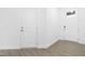 Bright entryway with durable wood-look flooring and two doors for convenience and style at 2140 Stegemann St, Apex, NC 27502