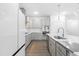 Well-lit kitchen with stainless steel appliances, a center island, and modern finishes at 2140 Stegemann St, Apex, NC 27502