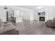 Spacious open-concept living area with fireplace flows seamlessly into a modern kitchen at 2140 Stegemann St, Apex, NC 27502