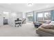 Bright living room with cozy seating and an outdoor balcony at 2140 Stegemann St, Apex, NC 27502