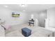 Open concept living room with television and neutral decor at 2140 Stegemann St, Apex, NC 27502