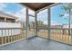 A cozy screened-in porch offers views of the fenced backyard and the surrounding neighborhood at 2140 Stegemann St, Apex, NC 27502