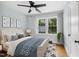 Bright and airy bedroom with hardwood floors, a ceiling fan, and ample natural light at 2206 Guess Rd, Durham, NC 27705
