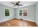 Bright bedroom with hardwood floors, and windows at 2206 Guess Rd, Durham, NC 27705