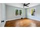 Bright bedroom with hardwood floors, ceiling fan and windows at 2206 Guess Rd, Durham, NC 27705