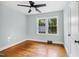 Bedroom with hardwood floors, ceiling fan, and windows at 2206 Guess Rd, Durham, NC 27705