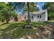 Charming single-story home with a welcoming front porch and mature trees in a residential neighborhood at 2206 Guess Rd, Durham, NC 27705