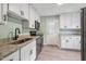 Modern kitchen with stainless steel appliances, granite countertops, and ample cabinet space at 2206 Guess Rd, Durham, NC 27705