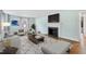 Bright living room featuring a fireplace, hardwood floors, and neutral decor at 2206 Guess Rd, Durham, NC 27705