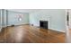 Spacious living room with hardwood floors and fireplace at 2206 Guess Rd, Durham, NC 27705