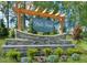 Neill's Pointe community sign with stone base and manicured landscaping at 230 Steel Spring Rd # 49, Angier, NC 27501