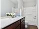 Bright bathroom with white quartz countertops and white tub-shower combo at 244 Potomac River St, Garner, NC 27529