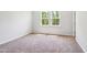 Bright bedroom with two large windows allowing ample natural light at 244 Potomac River St, Garner, NC 27529